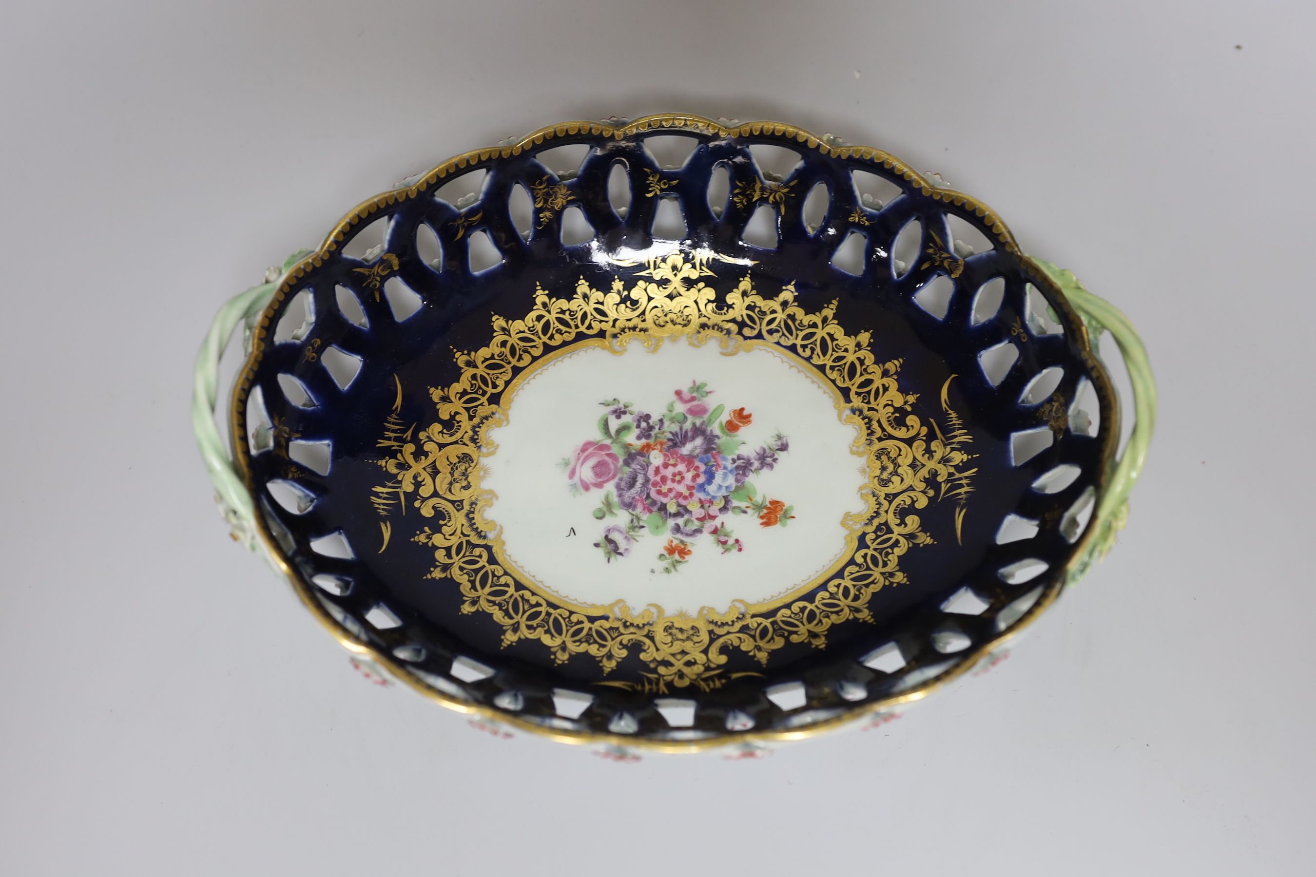 A Worcester two handled basket with pierced sides painted with flowers, surrounded by rich and elaborate gilding c.1770. 25cm wide Provenance: Zorensky Collection, Bonhams 22 February 2006, Lot 157